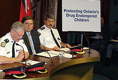 Toronto Police Supt. Ron Taverner (left), Tory MPP Garfield Dunlop and Orangeville Police Chief Joe Tomei (right) announce their support for Tory MPP Garfield Dunlop's private members bill that would consider kids growing up in marijuana grow-ops victims of child abuse. (ANTONELLA ARTUSO/Toronto Sun)